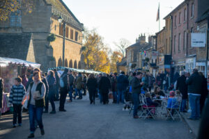 People at a Christmas market on a Go Cotswolds Christmas market tour